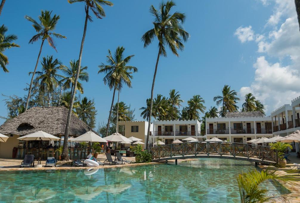 Pool area framed by tall palms