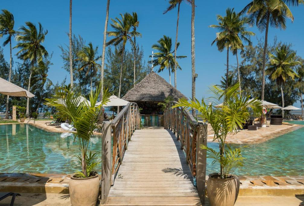 Wooden bridge leading to the poolside bar