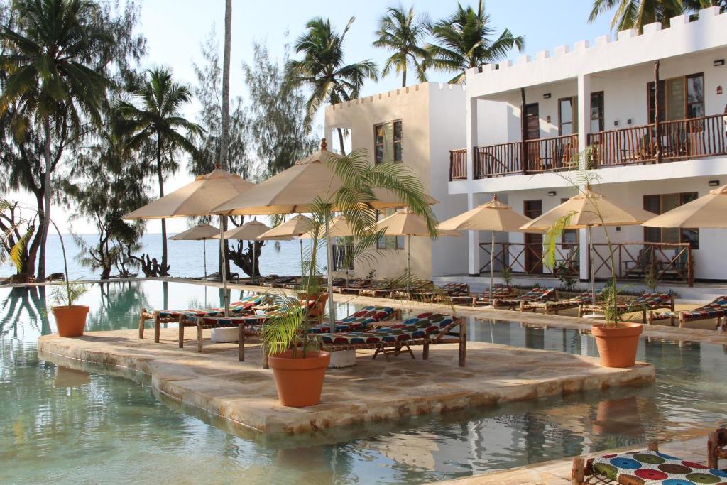 Sun loungers and umbrellas by the infinity pool