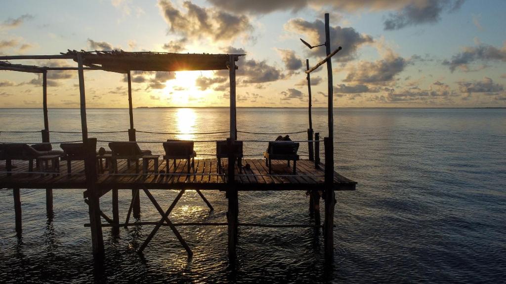 Sunrise jetty over calm Indian Ocean waters